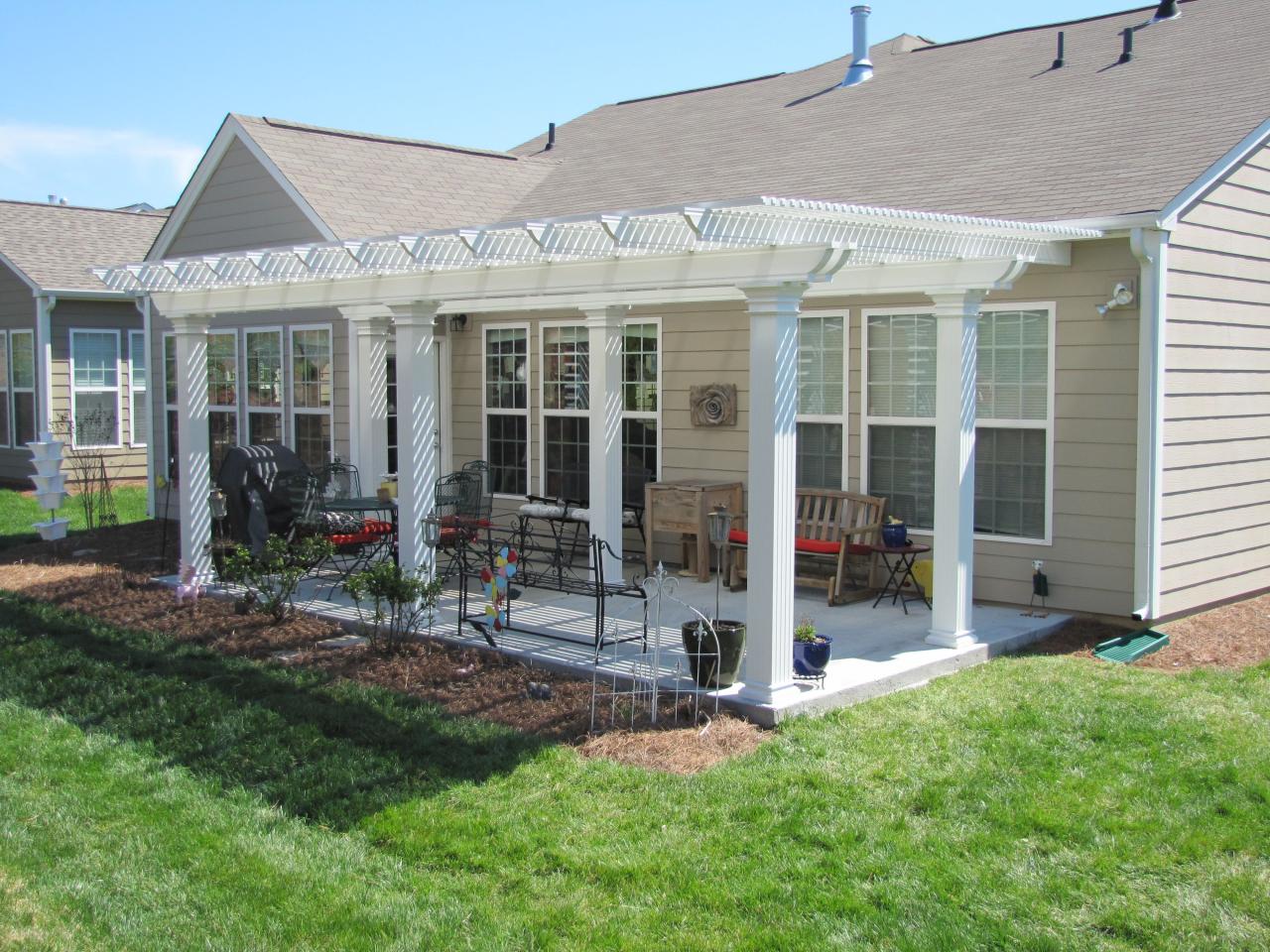 Metal pergola attached to house