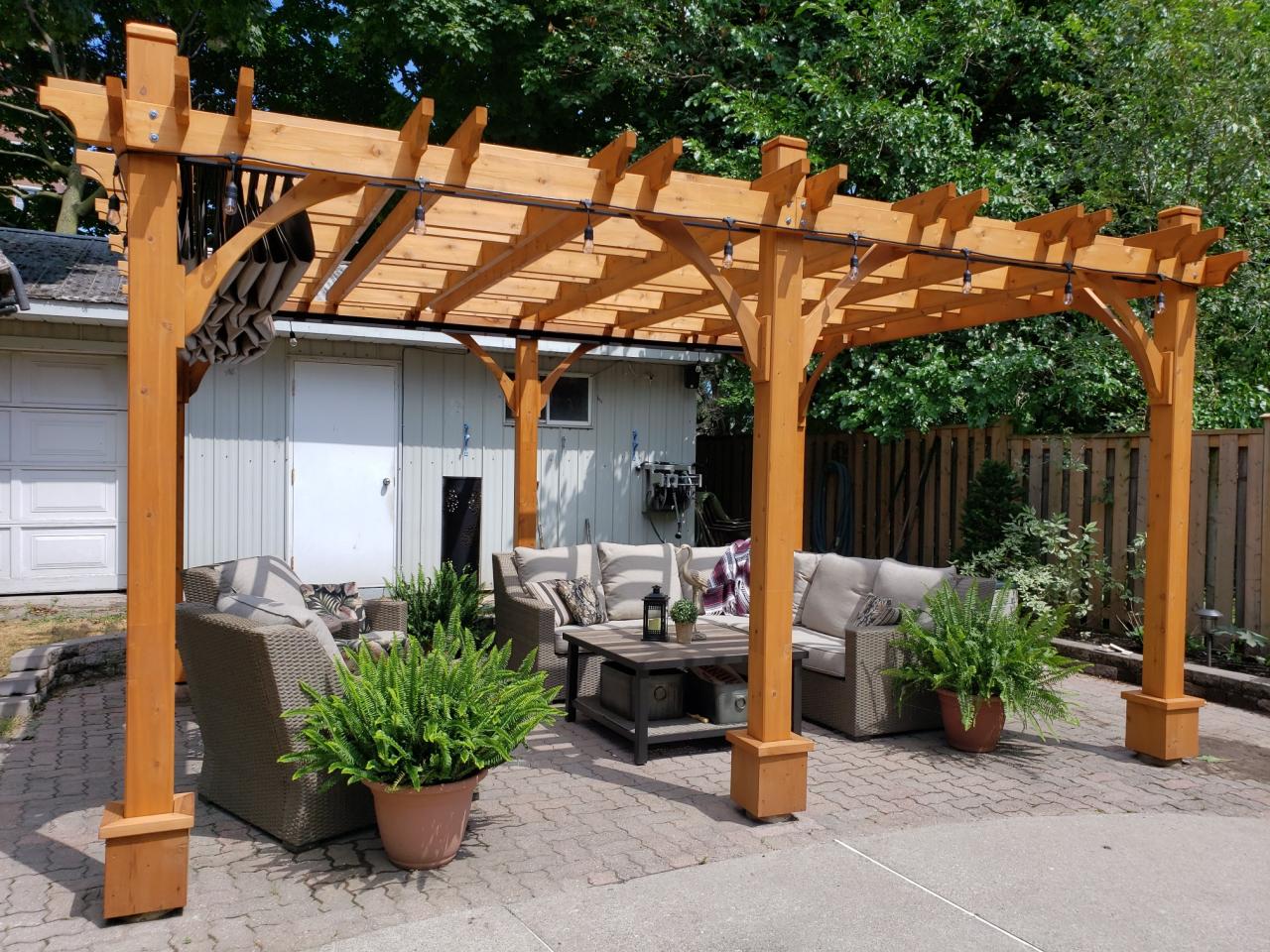 Wooden pergola with retractable roof