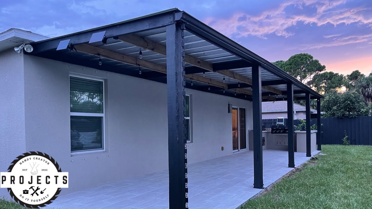 Metal pergola attached to house